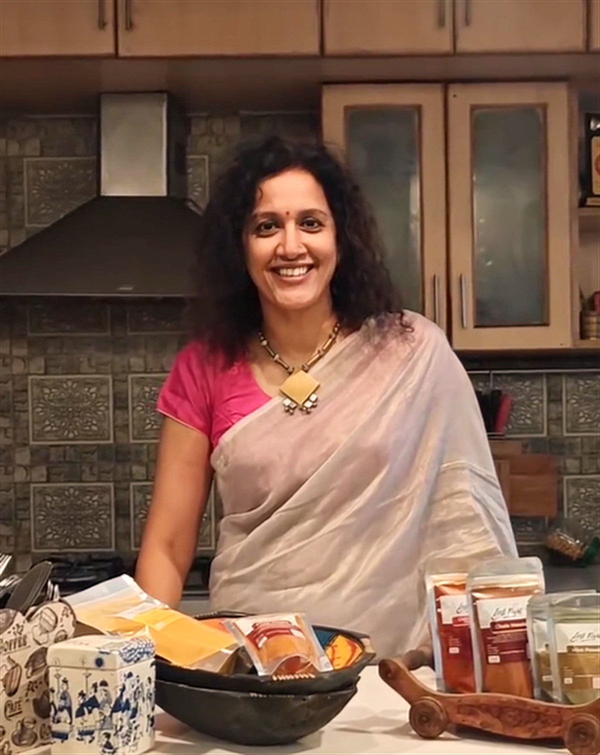 About Us Aparna, founder of Zest Right, in her Bangalore kitchen with her organic masalas and podis